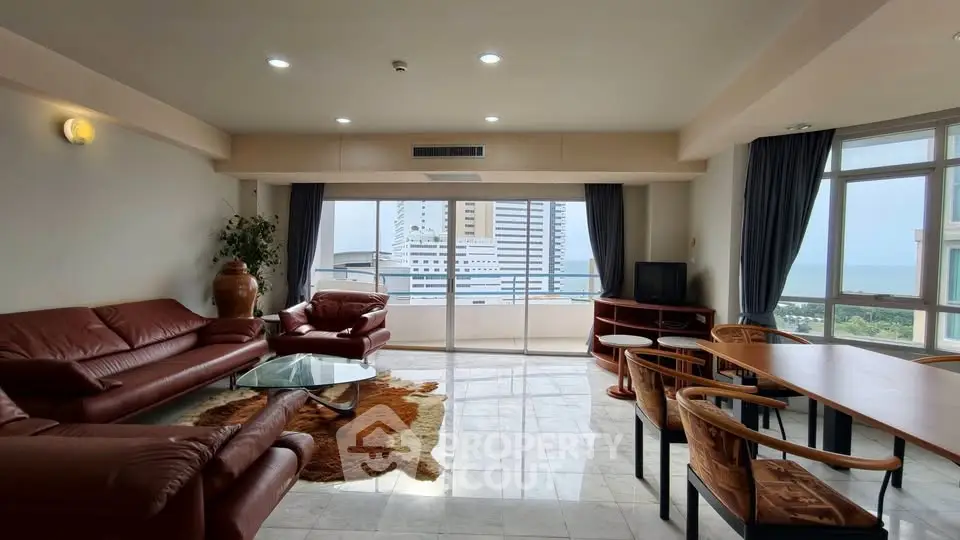 Spacious living room with ocean view and modern furnishings