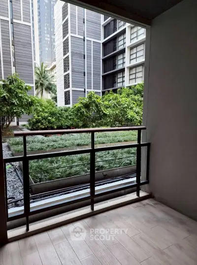 Modern balcony with garden view in urban residential complex