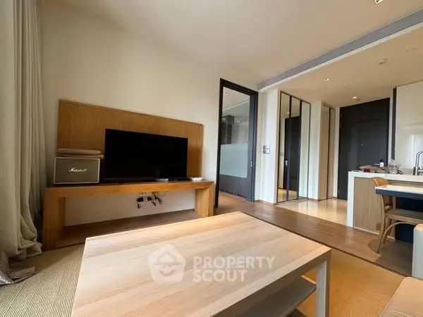 Modern living room with sleek design and open kitchen layout