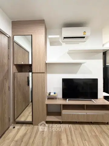 Modern living room with sleek wooden furniture and mounted air conditioner