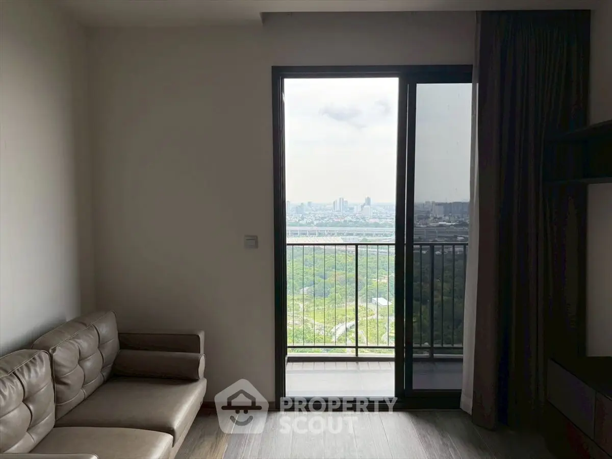 Modern living room with balcony offering stunning city view