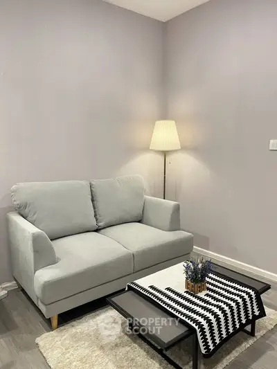 Cozy living room with modern sofa and stylish floor lamp