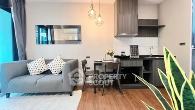 Modern open-layout living room with stylish kitchen and cozy seating area