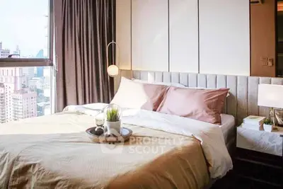 Luxurious bedroom with city view, featuring elegant decor and ample natural light.