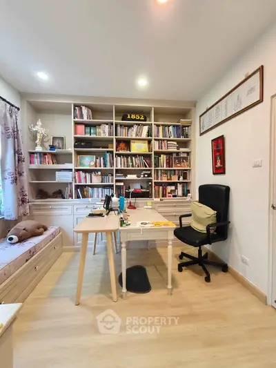 Cozy study room with built-in bookshelves and modern desk setup