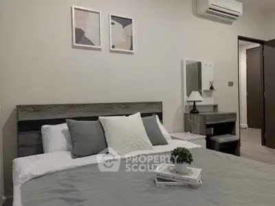 Modern bedroom with stylish decor and air conditioning, perfect for comfort and relaxation.