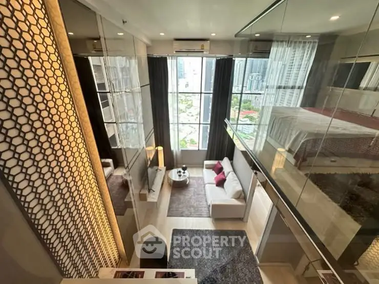 Luxurious modern loft with floor-to-ceiling windows and stylish decor in urban setting.