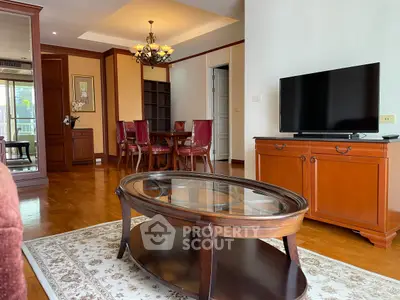 Elegant living room with classic wooden furniture and modern TV setup