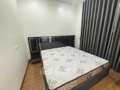 Modern bedroom with stylish headboard and comfortable mattress in a cozy apartment.