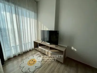 Modern living room with large window and stylish TV stand