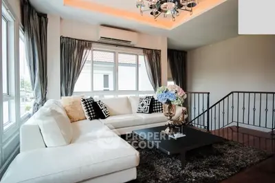 Luxurious living room with elegant decor and large windows