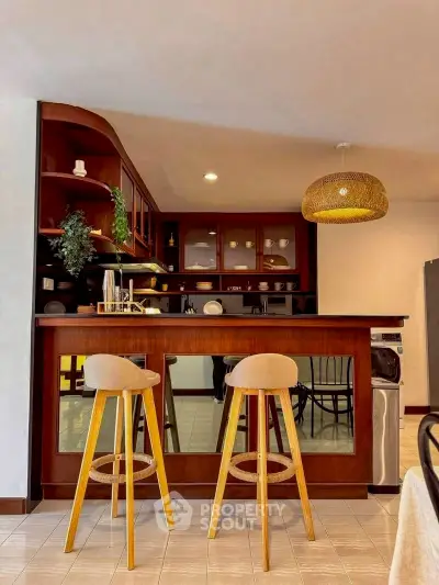 Chic kitchen with stylish bar stools and elegant wooden cabinetry