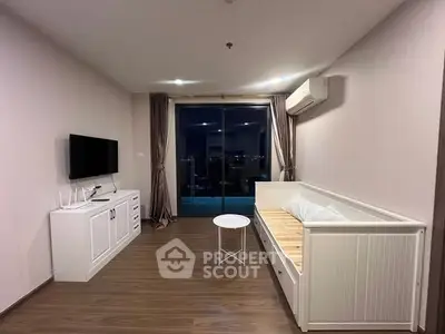 Modern living room with sleek furniture and balcony view