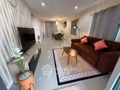 Modern living room with stylish decor and open dining area