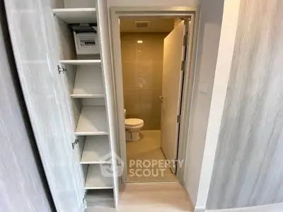 Modern bathroom with open shelving and sleek design