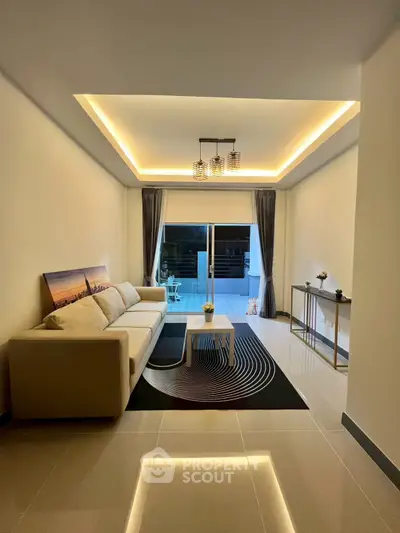 Modern living room with stylish lighting and balcony access