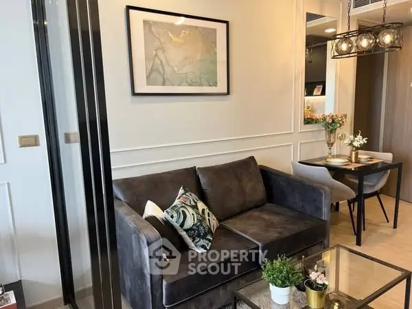 Stylish modern living room with cozy sofa and elegant dining area