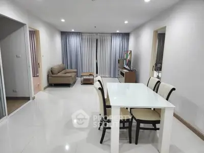 Spacious modern living room with dining area and elegant furnishings