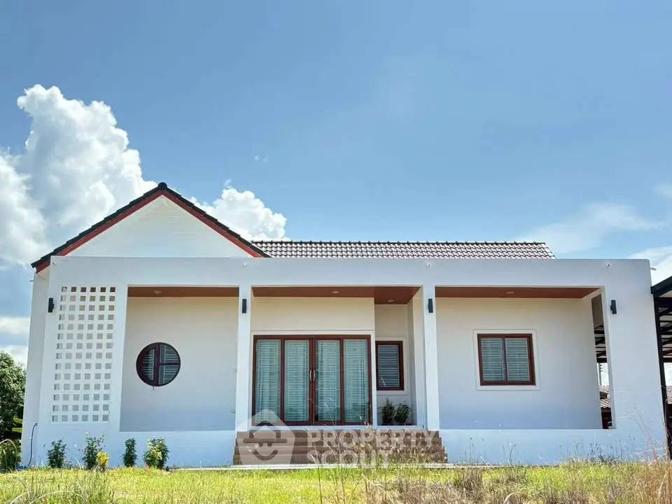 Charming modern bungalow with clean lines and lush green surroundings, perfect for serene living.