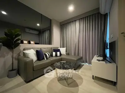 Modern living room with sleek furniture and stylish decor, featuring a cozy sectional sofa and chic coffee table.