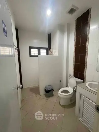 Spacious bathroom with modern fixtures and natural light