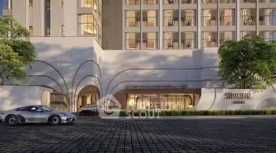 Luxurious modern building exterior with sleek design and high-end cars in front, showcasing elegance and sophistication.