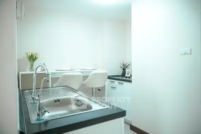 Modern kitchen with sleek design and breakfast bar seating