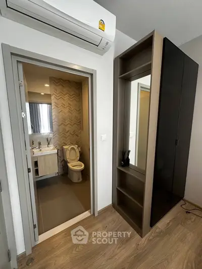 Modern apartment interior with bathroom and stylish storage unit