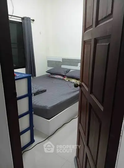 Cozy bedroom with modern decor and ample storage space