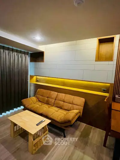 Modern living room with stylish sofa and wooden accents, perfect for cozy relaxation.
