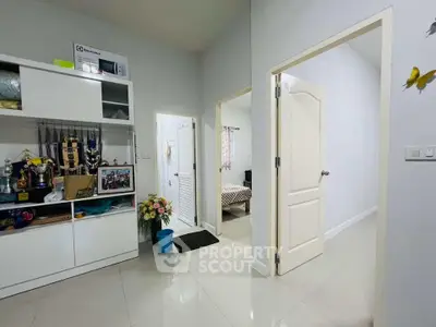 Spacious interior with modern decor and open layout, showcasing a cozy bedroom and stylish storage solutions.