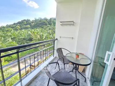 Charming balcony with lush green view, perfect for relaxation and enjoying nature.