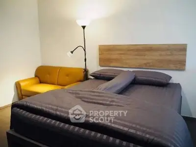 Cozy bedroom with stylish bed and modern lighting