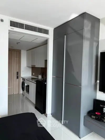 Modern apartment interior with sleek kitchen and stylish storage solutions