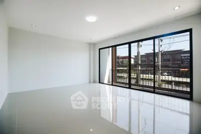 Spacious empty room with large windows and glossy tiled floor, perfect for customization.