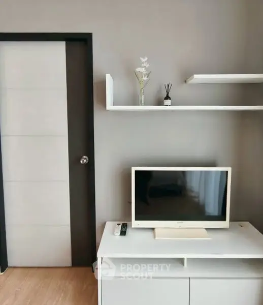 Modern living room with sleek TV setup and minimalist decor