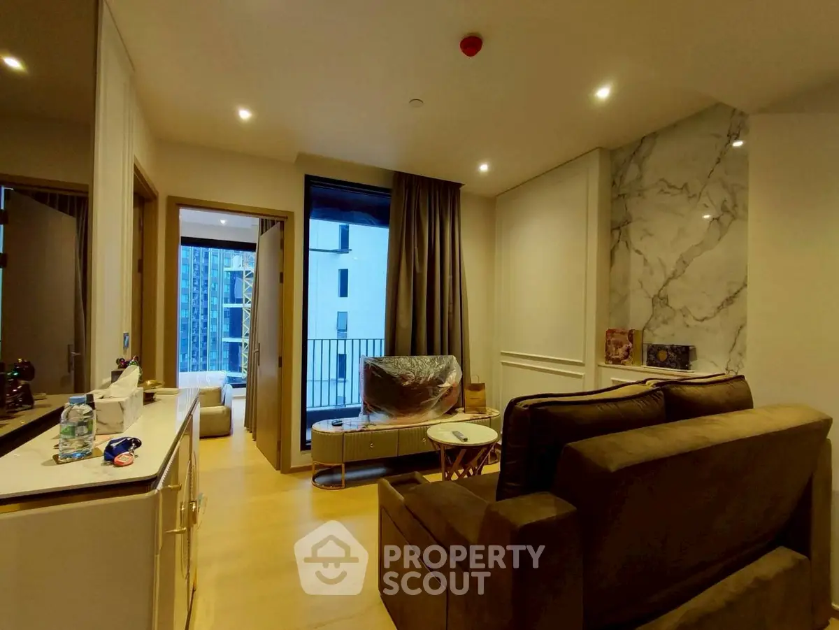 Modern living room with elegant decor and balcony view in luxury apartment
