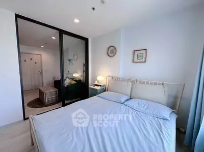 Modern bedroom with stylish decor and natural light