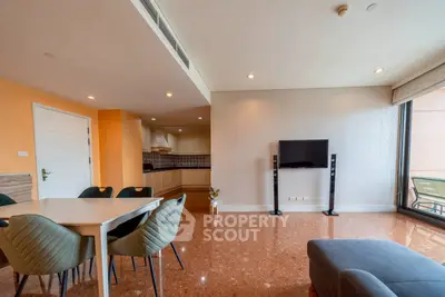 Spacious living room with modern decor and large windows for natural light.