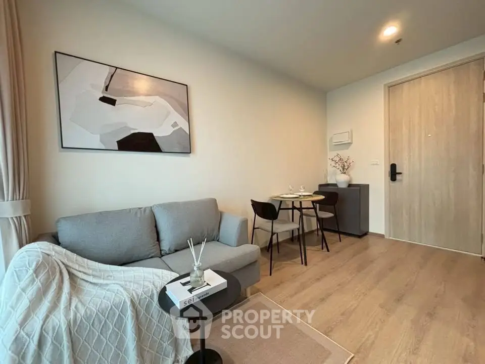 Modern living room with cozy sofa and stylish decor in a contemporary apartment.