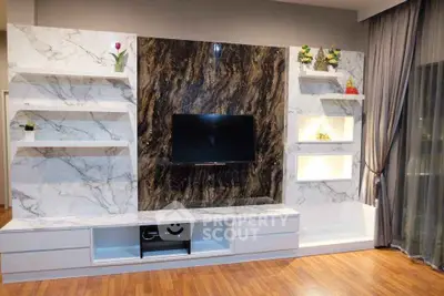 Luxurious living room with elegant marble TV wall and modern decor