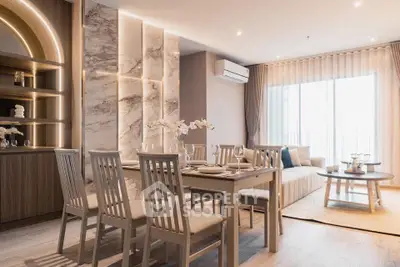 Luxurious open-plan living and dining area with elegant decor and natural light.