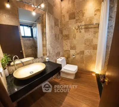 Luxurious bathroom with elegant stone tiles and modern fixtures