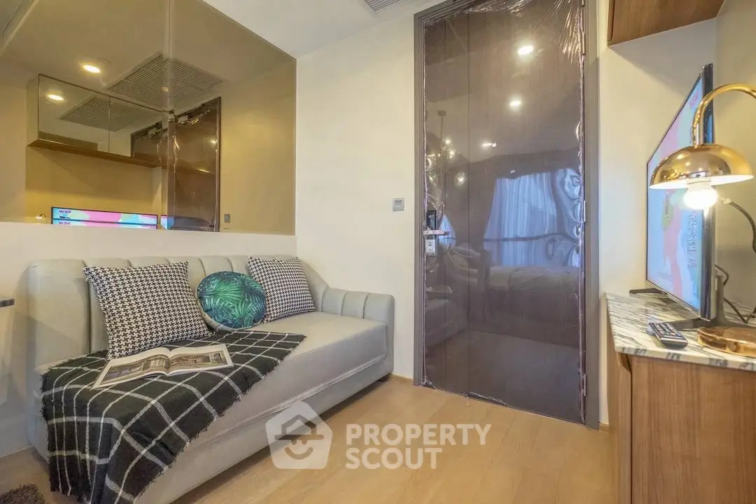 Cozy living room with modern decor and stylish lighting, perfect for relaxation and entertainment.