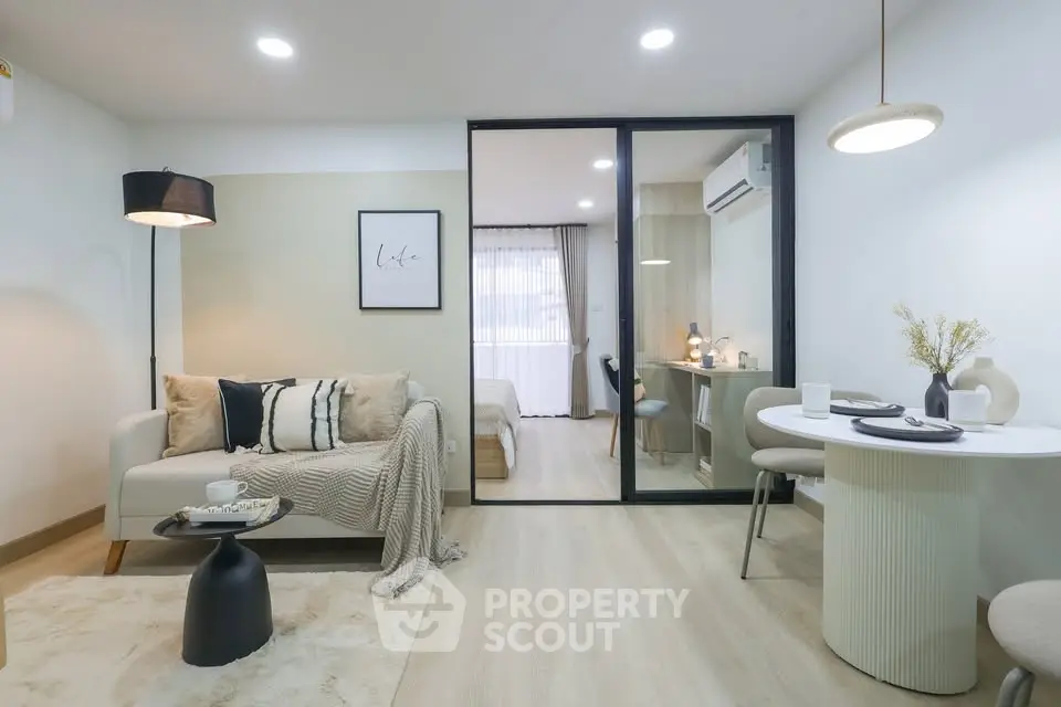 Modern open-concept living room with cozy decor and stylish furniture