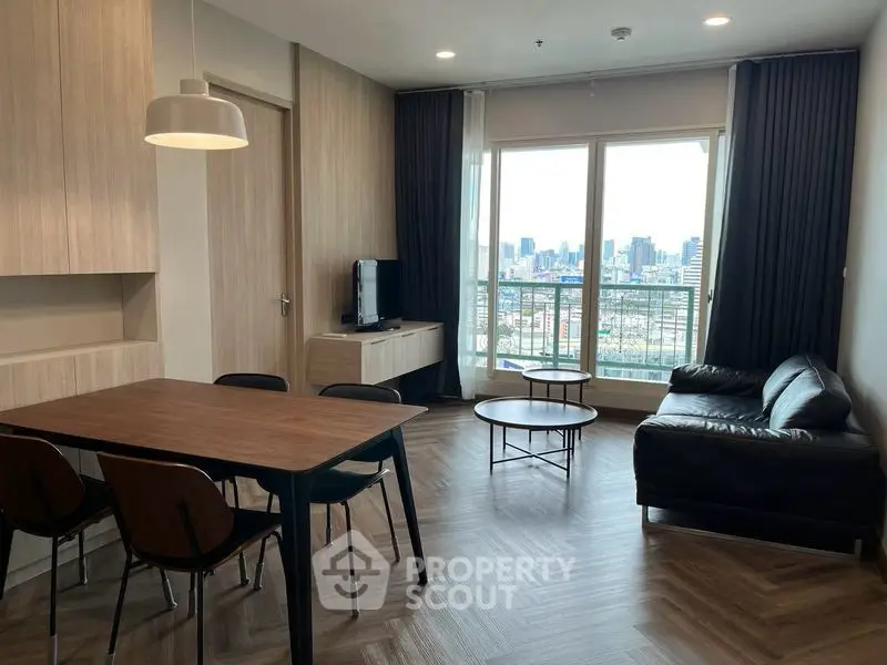 Modern living room with city view, stylish furniture, and elegant decor