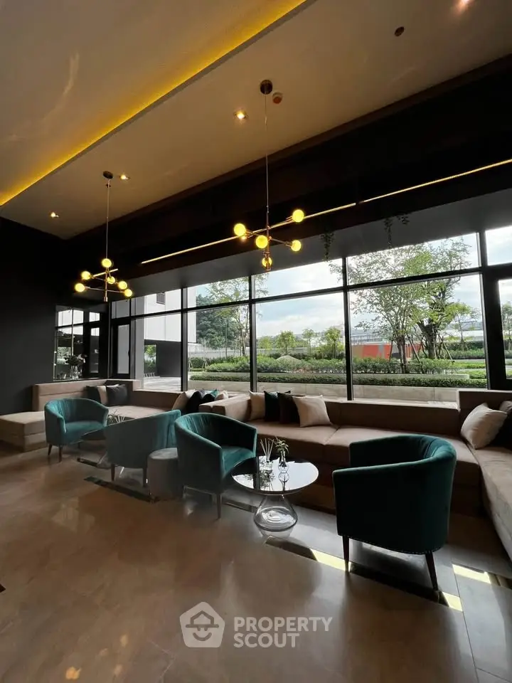 Luxurious modern lounge with elegant seating and large windows offering scenic views.