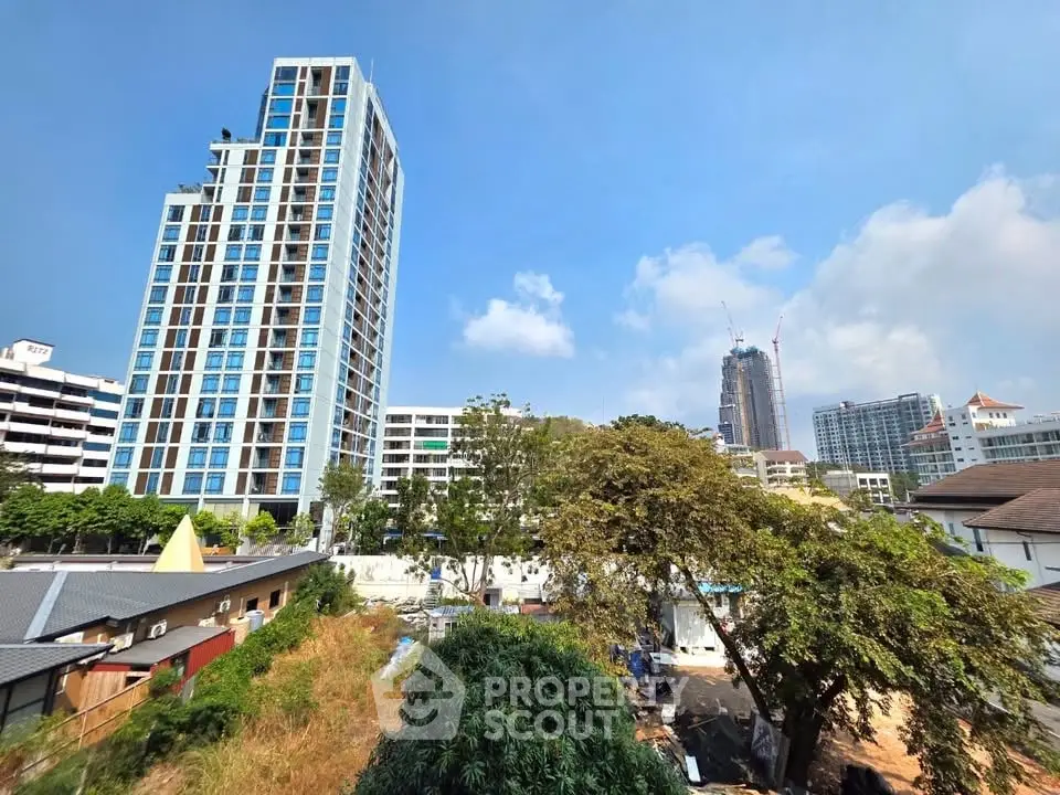 Stunning high-rise building with clear blue sky in urban landscape