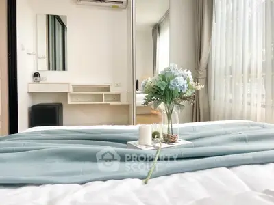 Elegant bedroom with soft lighting and stylish decor, featuring a cozy bed and large windows.