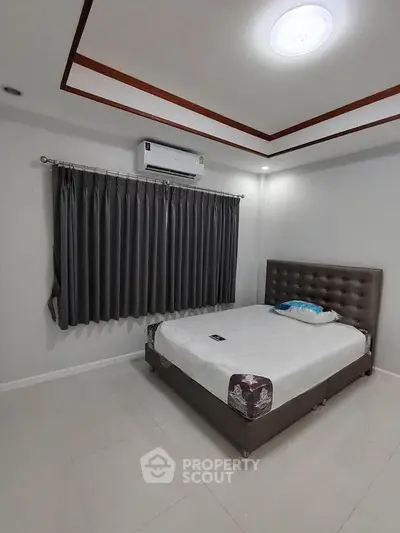 Modern bedroom with stylish bed and air conditioning in a cozy apartment